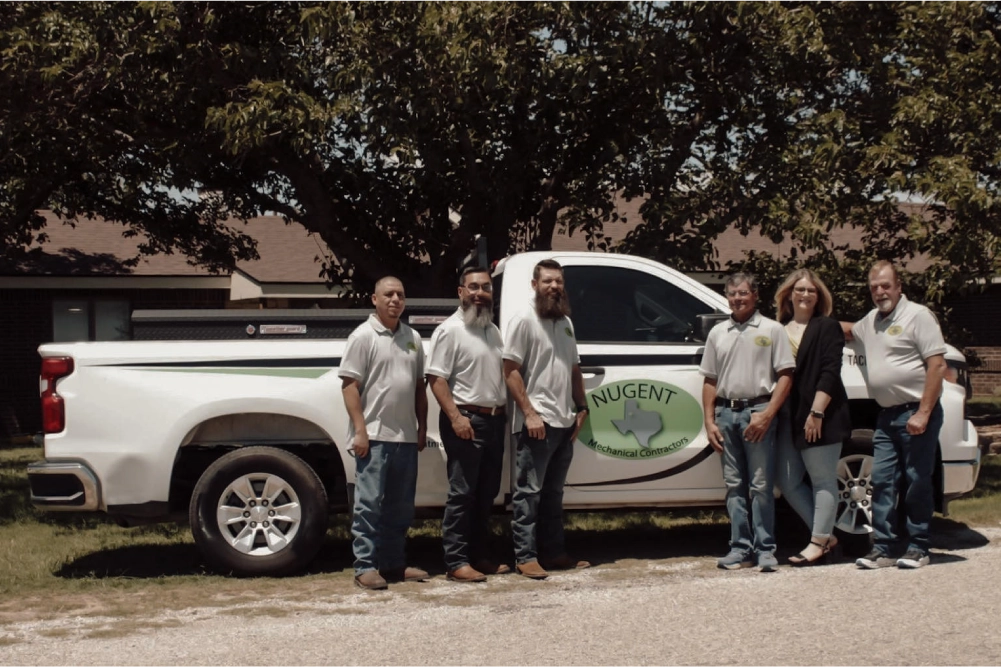 nugent mechanical contractors meet the team standing by company truck